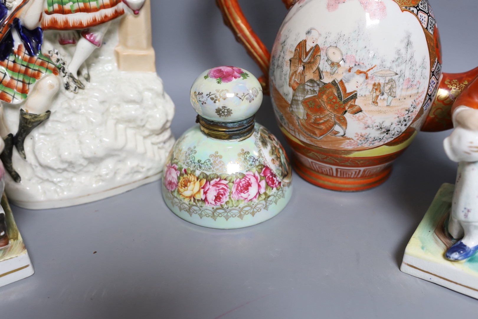 A Victorian Staffordshire flatback group, a pair of Staffordshire figures, an inkwell and a Japanese kutani coffee pot 32cm